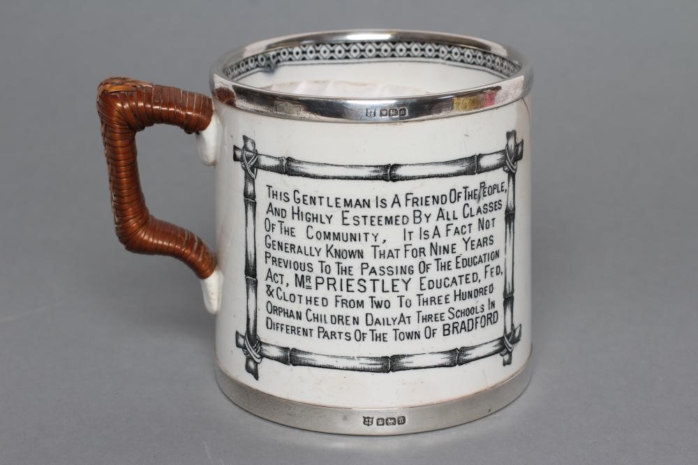 OF LOCAL LEEDS INTEREST - an Edwardian silver mounted earthenware mug of plain cylindrical form with Image