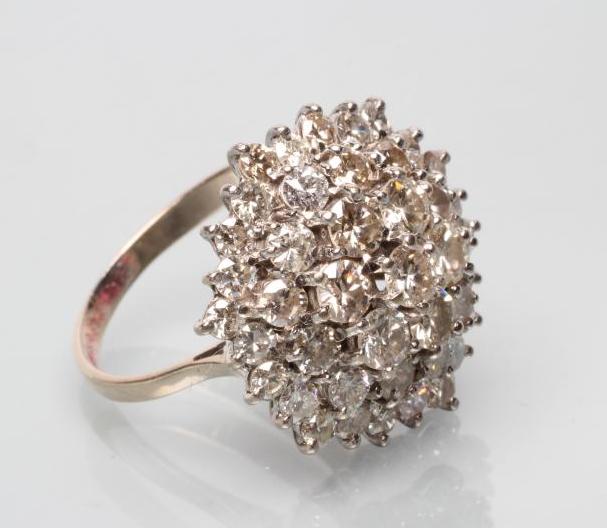 A DIAMOND CLUSTER DOMED COCKTAIL RING Image