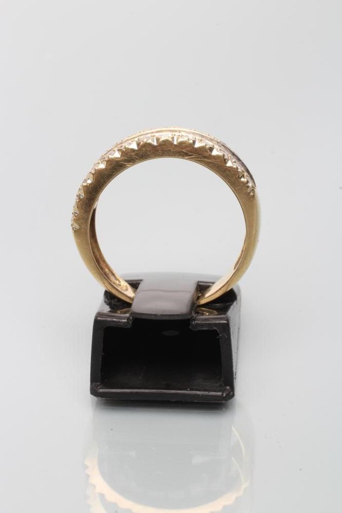 A DIAMOND HALF HOOP ETERNITY RING Image