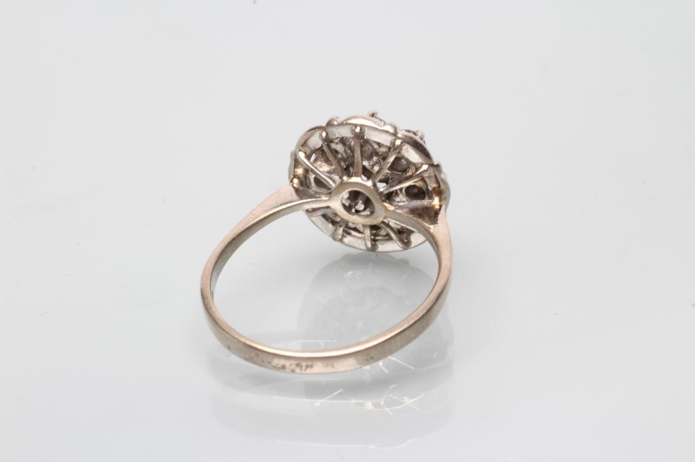 A NINE STONE DIAMOND CLUSTER RING Image