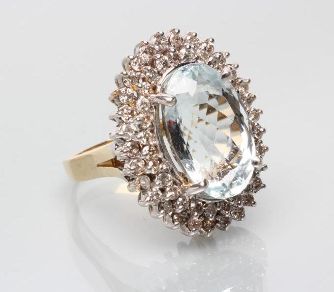 A LARGE AQUAMARINE AND DIAMOND CLUSTER RING Image