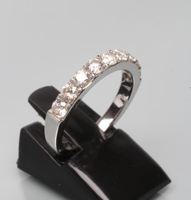 A NINE STONE DIAMOND HALF HOOP ETERNITY RING Image