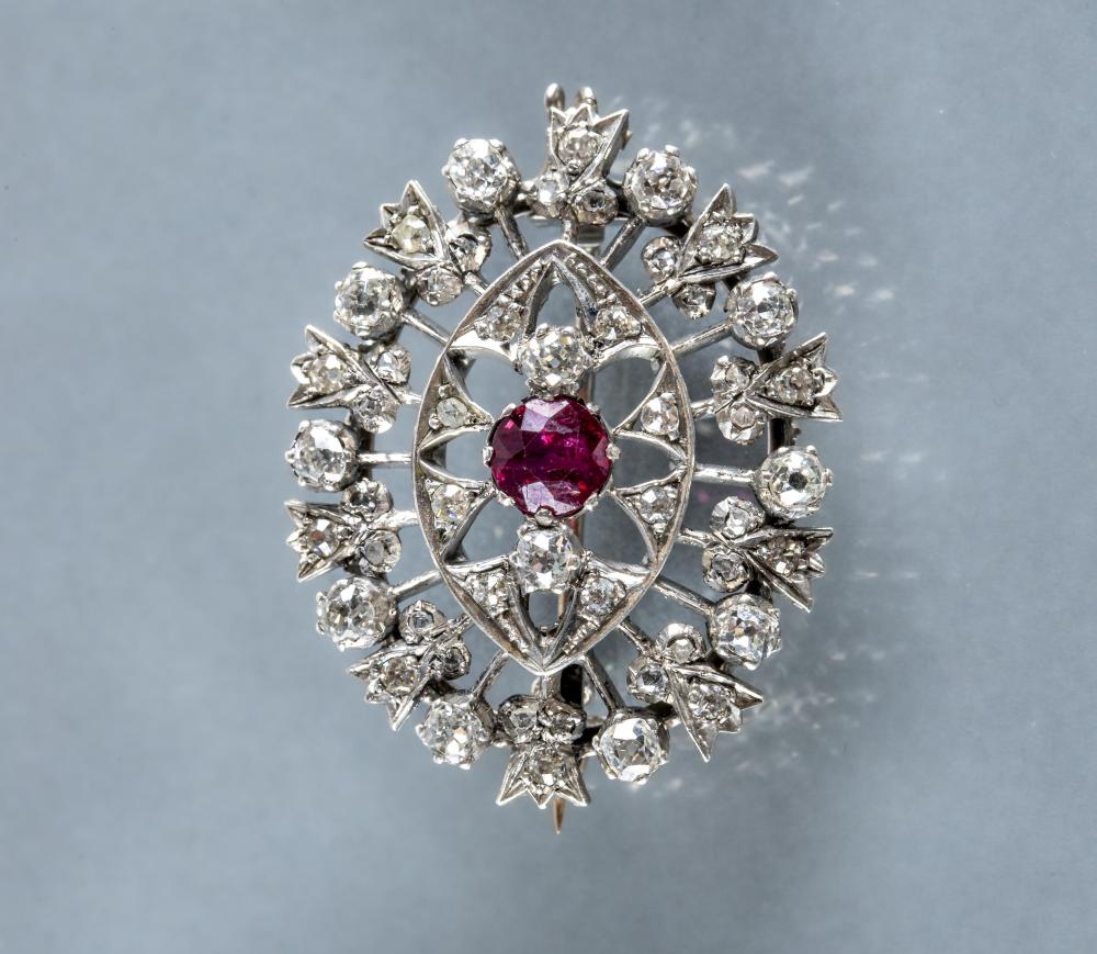 AN EDWARDIAN DIAMOND BAR BROOCH centred by a square panel pave set with four small stones and two Image