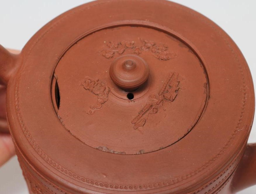 AN ENGLISH REDWARE TEAPOT AND COVER Image