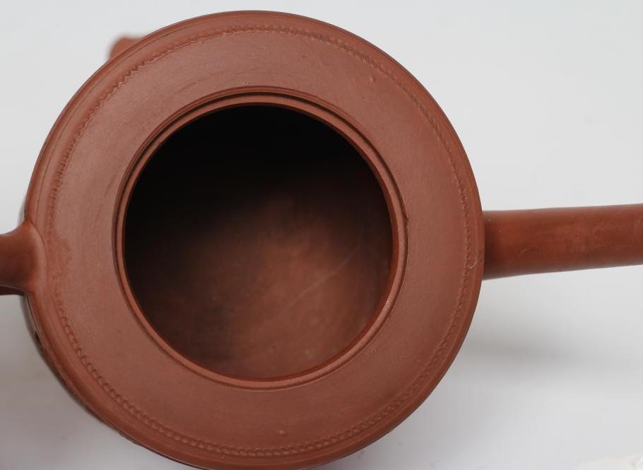 AN ENGLISH REDWARE TEAPOT AND COVER Image