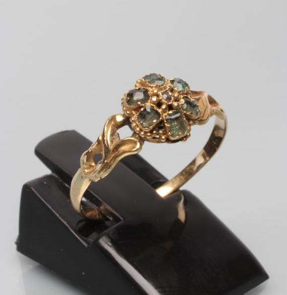 A VICTORIAN EMERALD AND DIAMOND CLUSTER RING Image