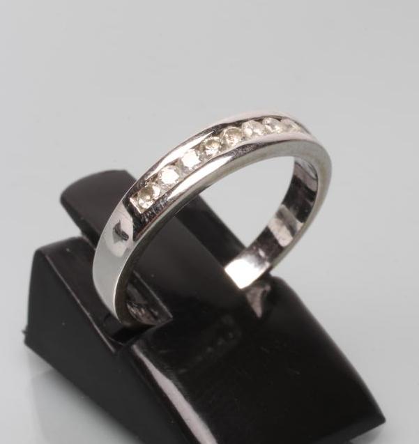 A TEN STONE DIAMOND HALF HOOP ETERNITY RING Image
