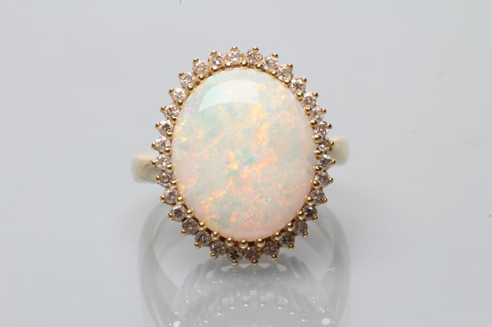 AN OPAL AND DIAMOND CLUSTER DRESS RING Image