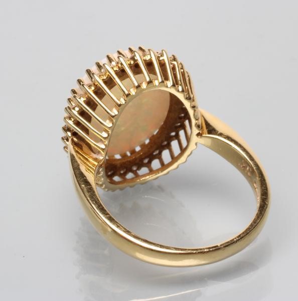 AN OPAL AND DIAMOND CLUSTER DRESS RING Image