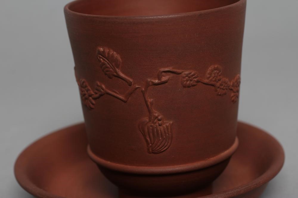 AN ELERS TYPE REDWARE CAPPUCINE AND SAUCER Image