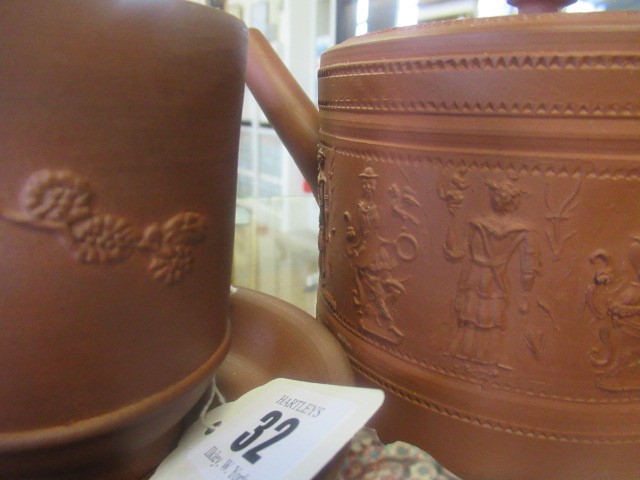 AN ELERS TYPE REDWARE CAPPUCINE AND SAUCER Image