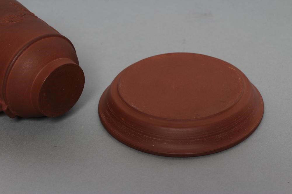 AN ELERS TYPE REDWARE CAPPUCINE AND SAUCER Image