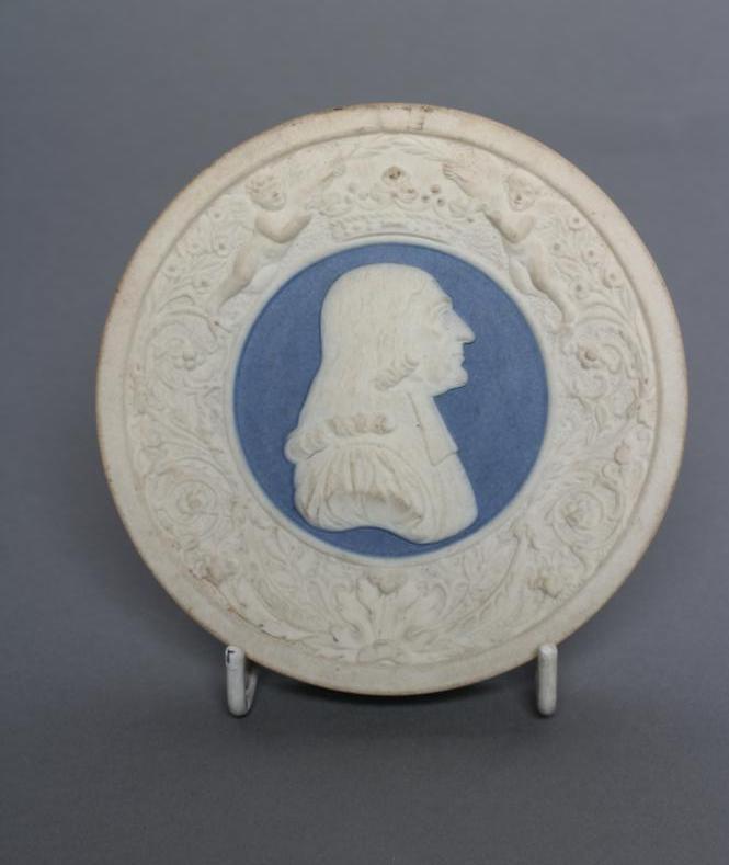 A VICTORIAN DRY BODIED ROUNDEL centrally applied with a bust portrait of Wesley on a blue ground Image