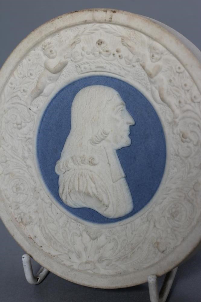 A VICTORIAN DRY BODIED ROUNDEL centrally applied with a bust portrait of Wesley on a blue ground Image