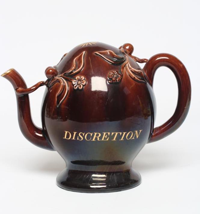 A ROCKINGHAM BROWN GLAZED STONEWARE CADOGAN TEAPOT Image