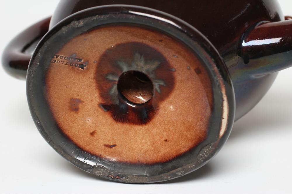 A ROCKINGHAM BROWN GLAZED STONEWARE CADOGAN TEAPOT Image