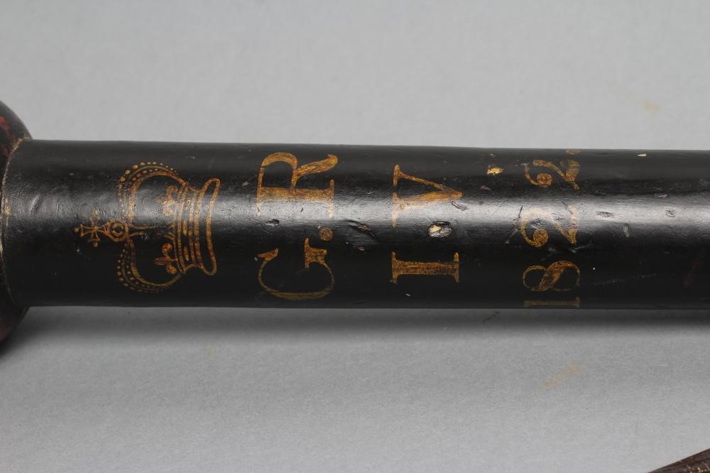 A POLICE TRUNCHEON of knobkerrie form with bulbous head painted in black and red Image
