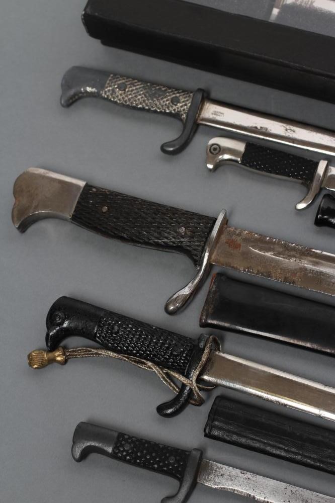 A COLLECTION OF SEVEN MINIATURE BAYONETS Image