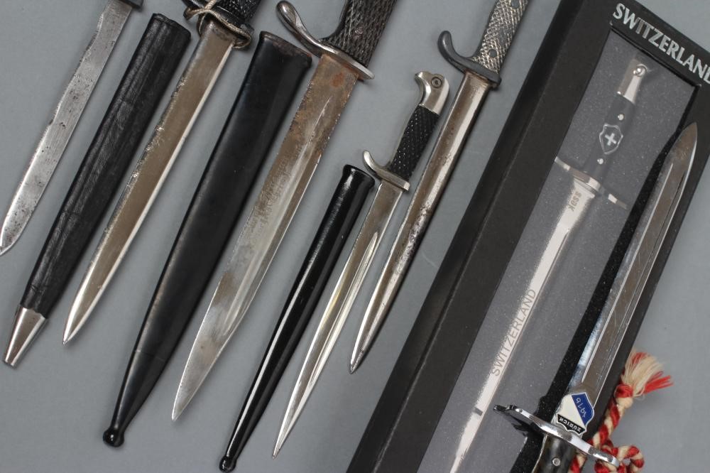 A COLLECTION OF SEVEN MINIATURE BAYONETS Image