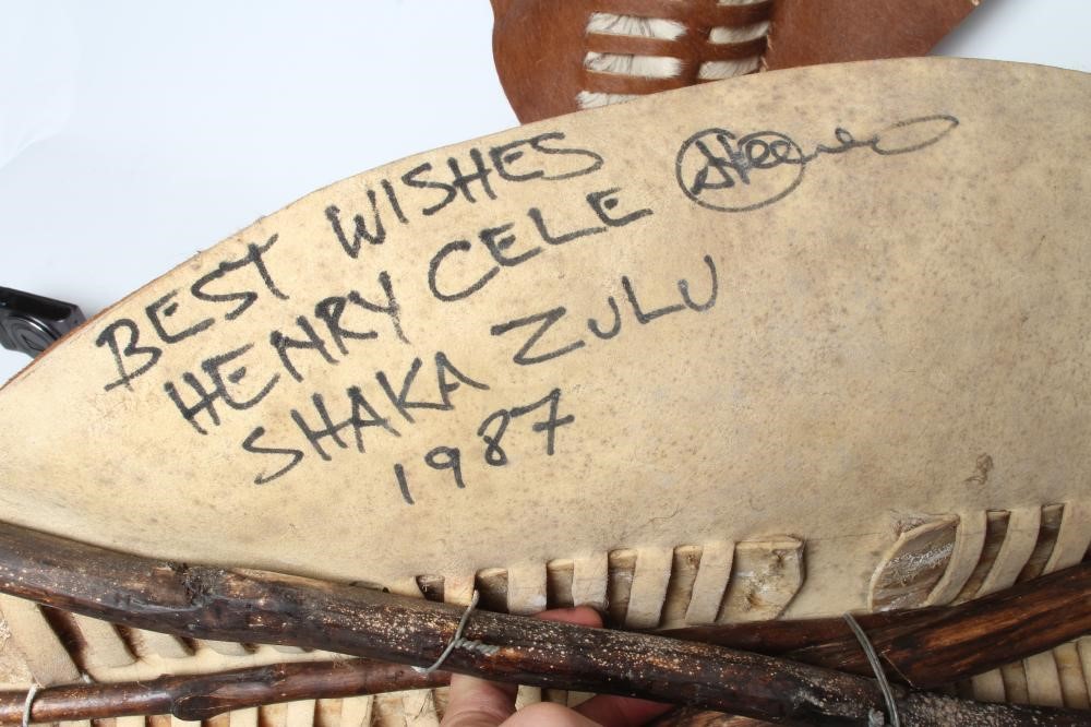 A PAIR OF REPRODUCTION ZULU SHIELD DISPLAYS SIGNED BY ACTOR HENRY CELE Image