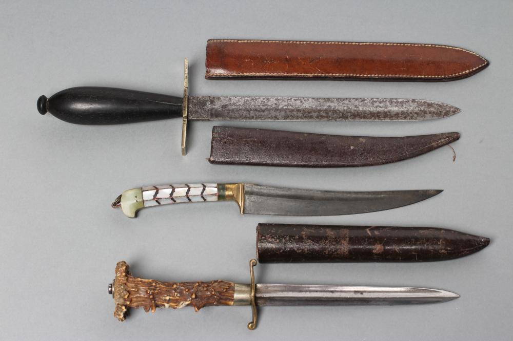 THREE SHEATHED DAGGERS Image