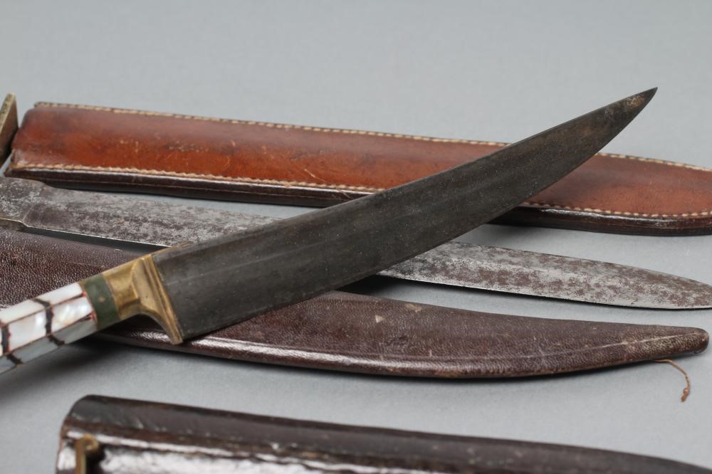 THREE SHEATHED DAGGERS Image