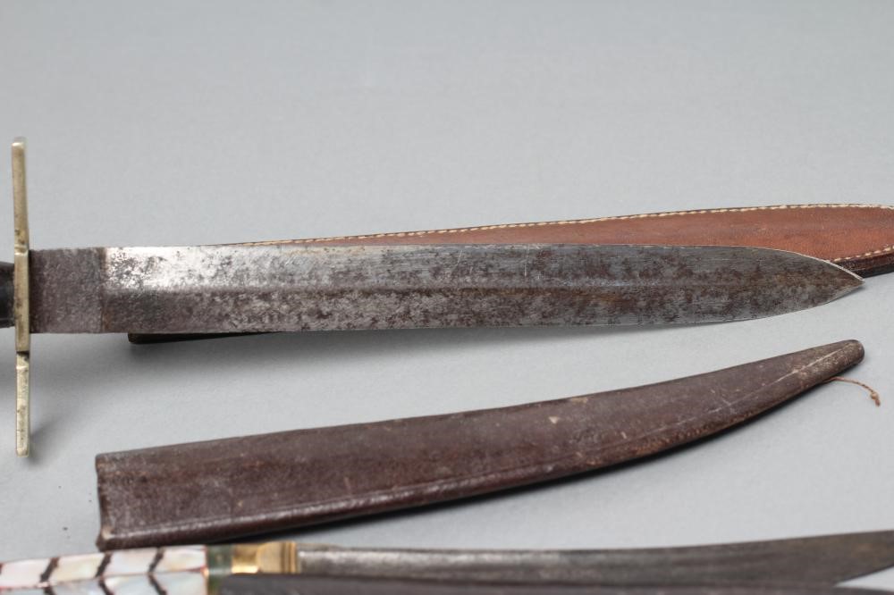 THREE SHEATHED DAGGERS Image