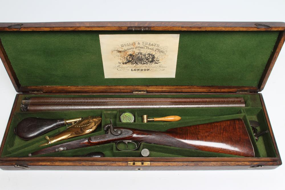 A HOLLIS & SHEATH 12 BORE DOUBLE BARRELLED PERCUSSION SHOTGUN Image