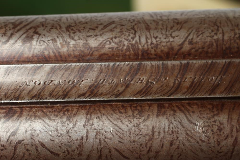 A HOLLIS & SHEATH 12 BORE DOUBLE BARRELLED PERCUSSION SHOTGUN Image