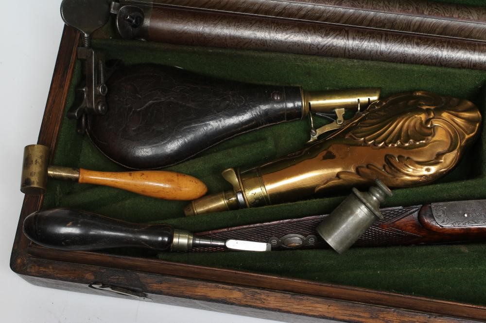 A HOLLIS & SHEATH 12 BORE DOUBLE BARRELLED PERCUSSION SHOTGUN Image