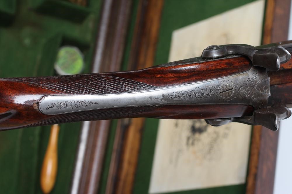 A HOLLIS & SHEATH 12 BORE DOUBLE BARRELLED PERCUSSION SHOTGUN Image