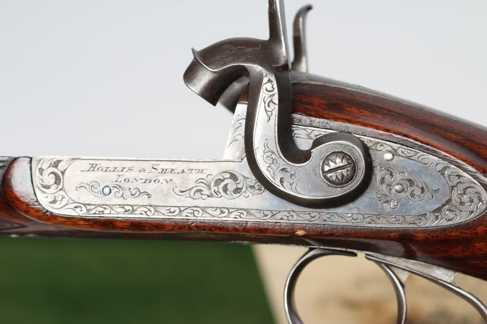 A HOLLIS & SHEATH 12 BORE DOUBLE BARRELLED PERCUSSION SHOTGUN Image