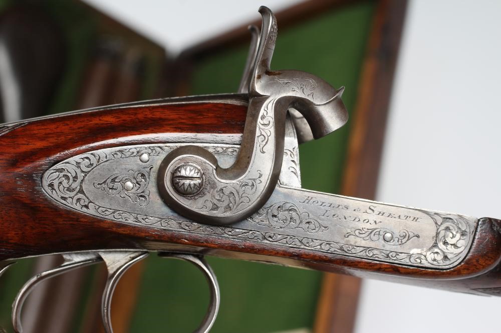 A HOLLIS & SHEATH 12 BORE DOUBLE BARRELLED PERCUSSION SHOTGUN Image