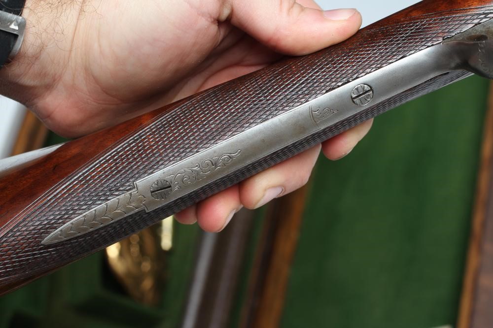 A HOLLIS & SHEATH 12 BORE DOUBLE BARRELLED PERCUSSION SHOTGUN Image