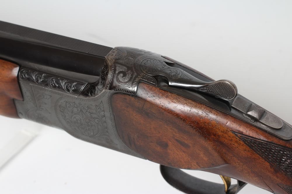 A MIROKU OVER & UNDER 12 BORE SHOTGUN Image