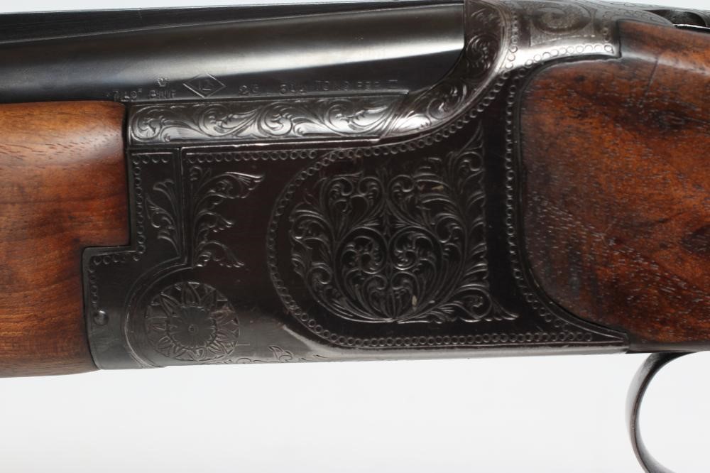 A MIROKU OVER & UNDER 12 BORE SHOTGUN Image