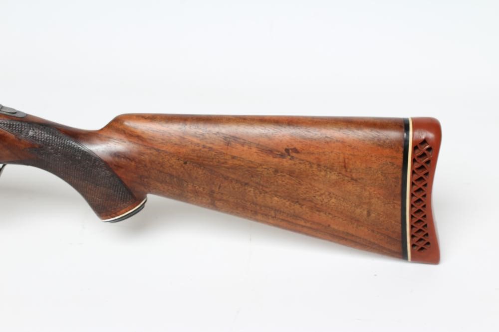 A MIROKU OVER & UNDER 12 BORE SHOTGUN Image