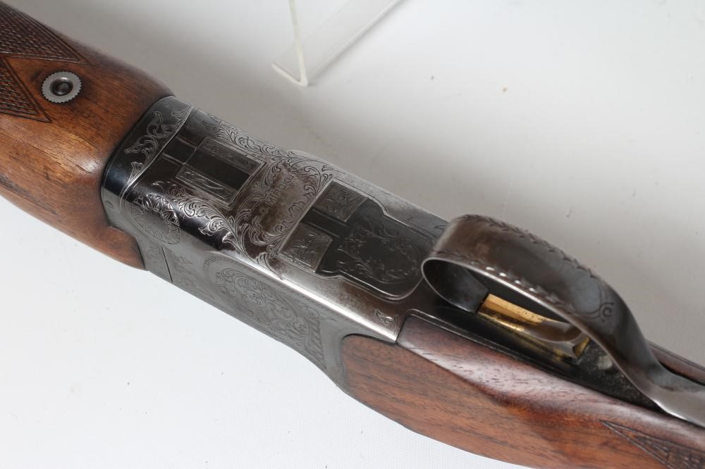 A MIROKU OVER & UNDER 12 BORE SHOTGUN Image