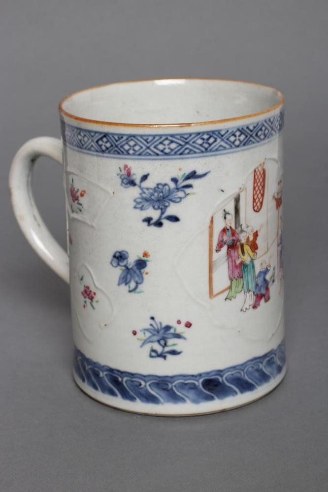 A CHINESE PORCELAIN MUG of plain cylindrical form with pulled handle Image
