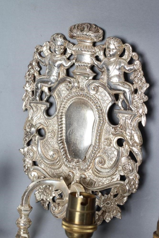 A PAIR OF SILVERED METAL TWIN BRANCH WALL SCONCES in the William & Mary style Image