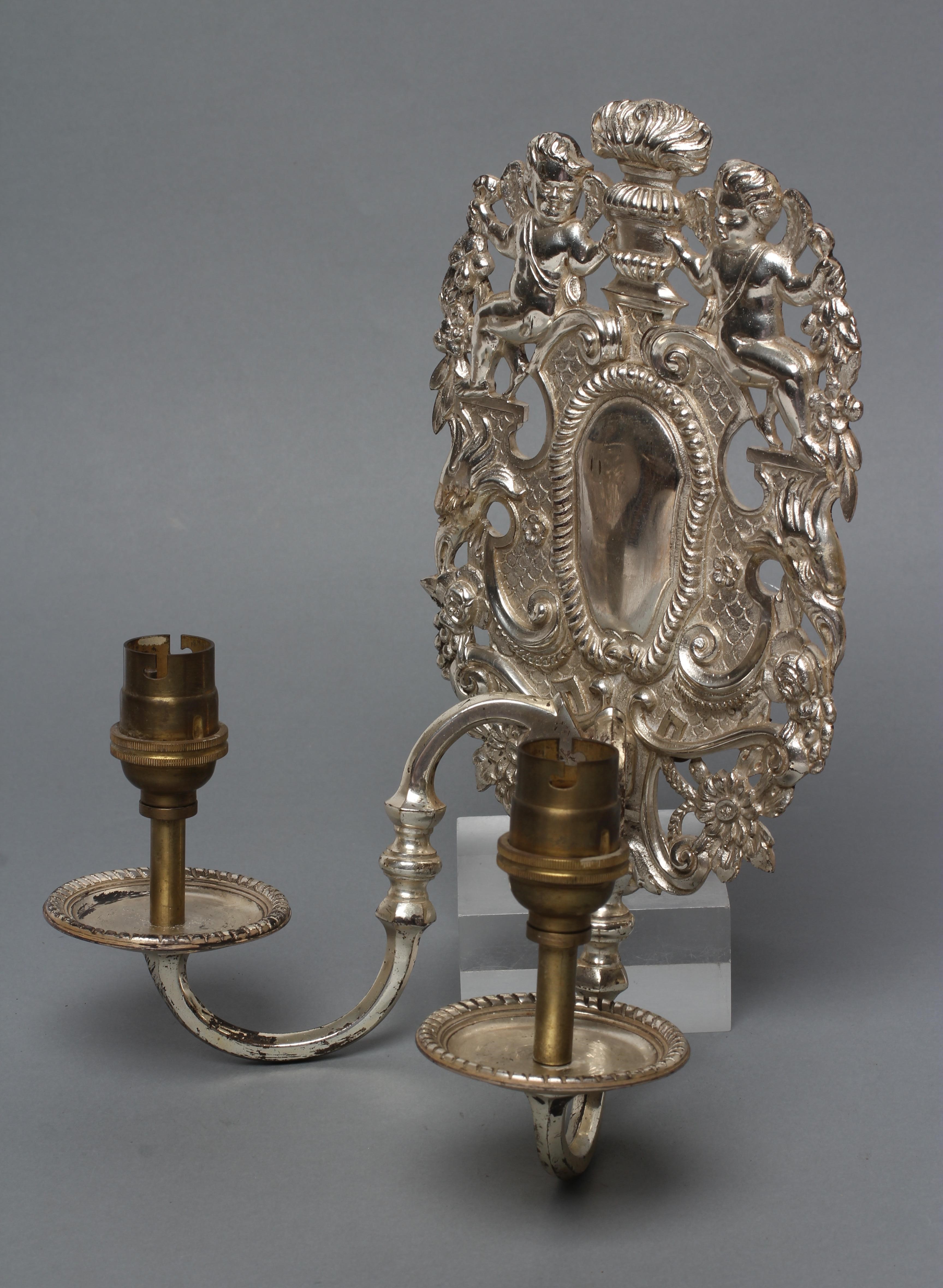 A PAIR OF SILVERED METAL TWIN BRANCH WALL SCONCES in the William & Mary style Image