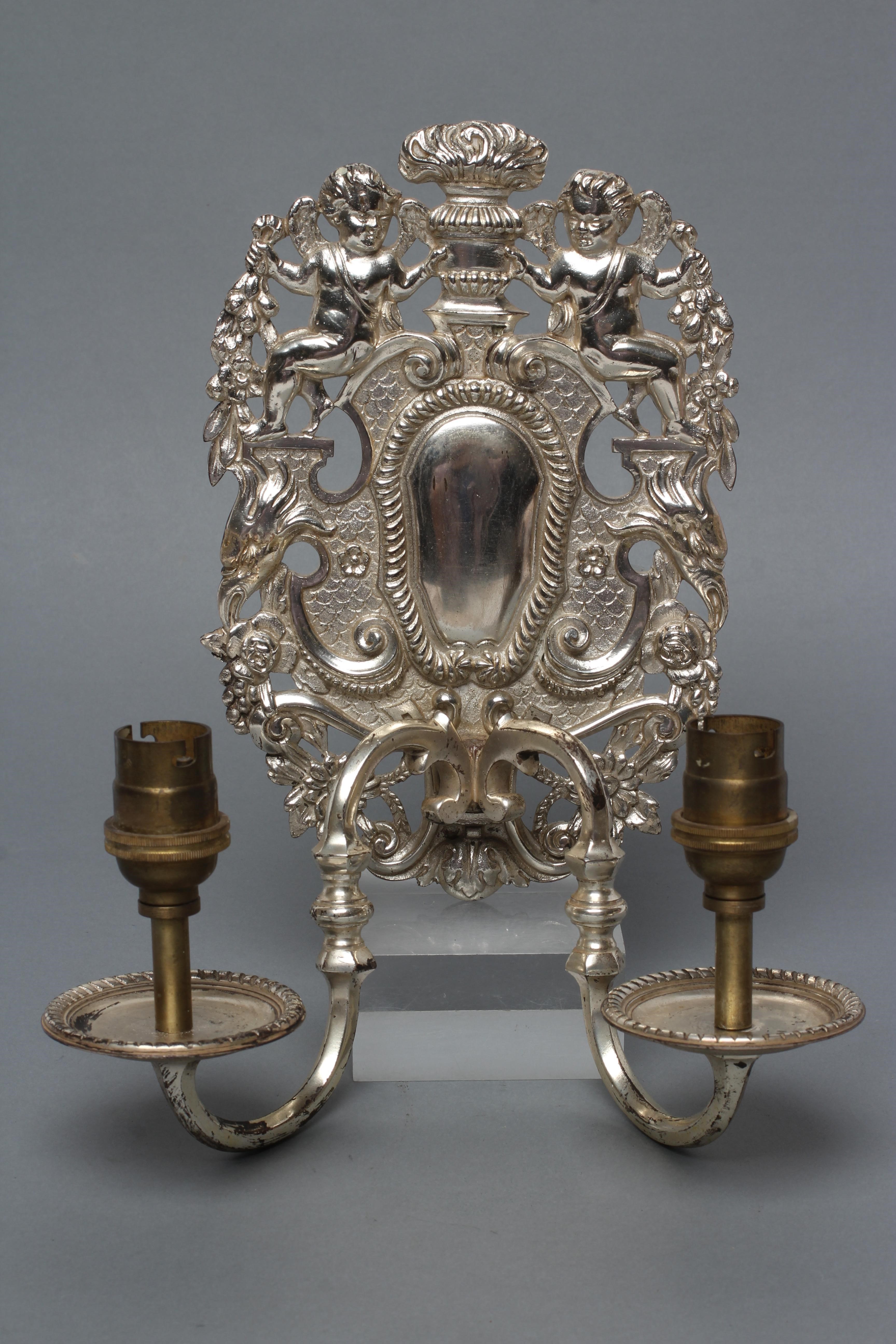 A PAIR OF SILVERED METAL TWIN BRANCH WALL SCONCES in the William & Mary style Image