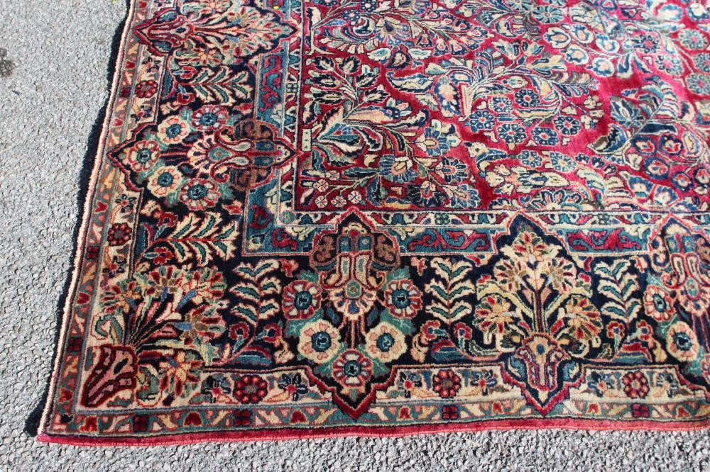 A persian carpet Hartleys Auctioneers & Valuers
