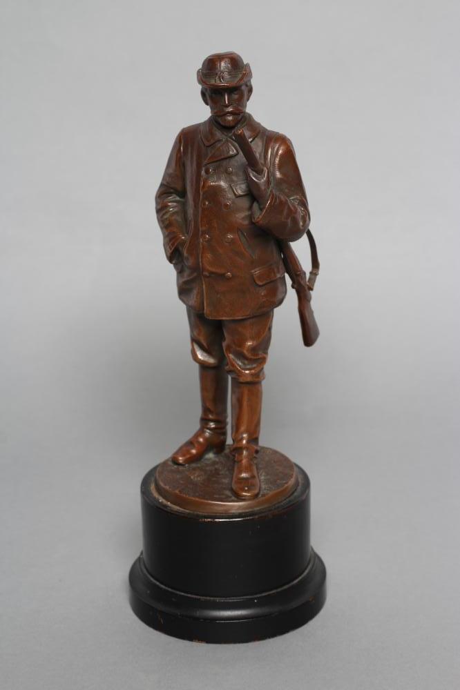 A BRONZE FIGURE of a male hunter Image