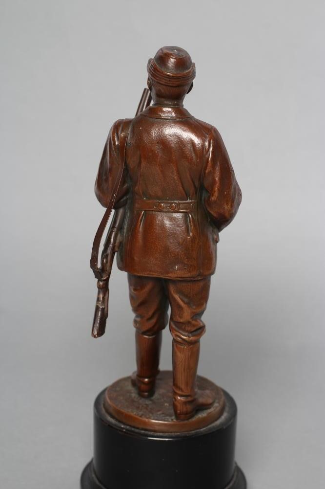 A BRONZE FIGURE of a male hunter Image