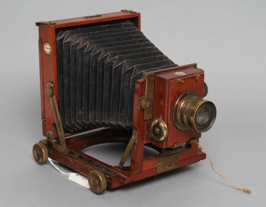 A THORNTON PICKARD "TRIBUNE" FIELD CAMERA of wooden construction with brass fittings and rectoplanat Image