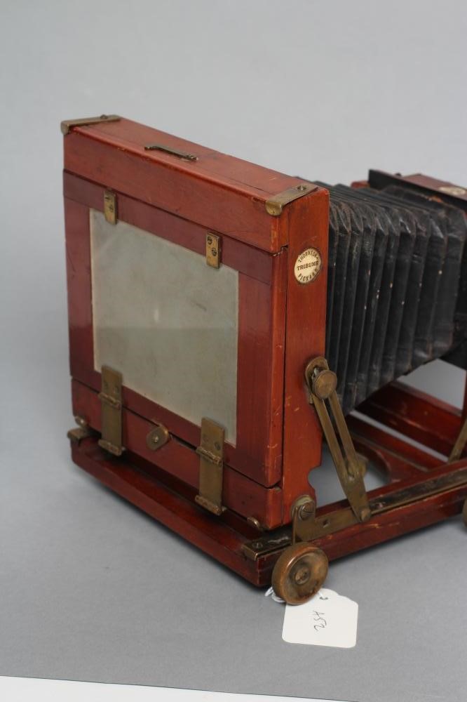 A THORNTON PICKARD "TRIBUNE" FIELD CAMERA of wooden construction with brass fittings and rectoplanat Image
