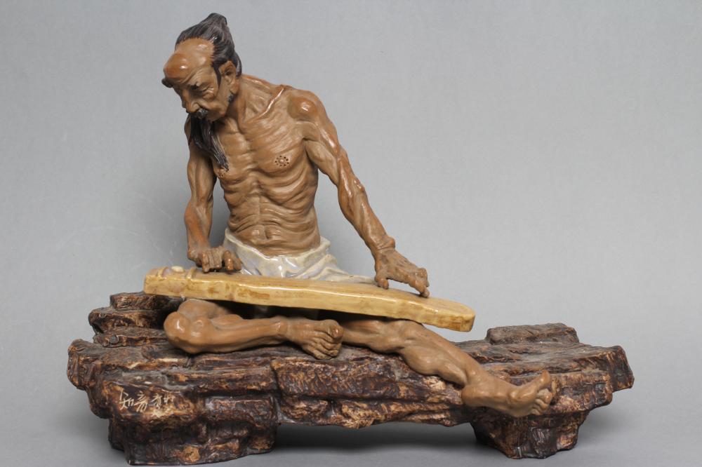 A CHINESE SHIWAN STONEWARE FIGURE Image