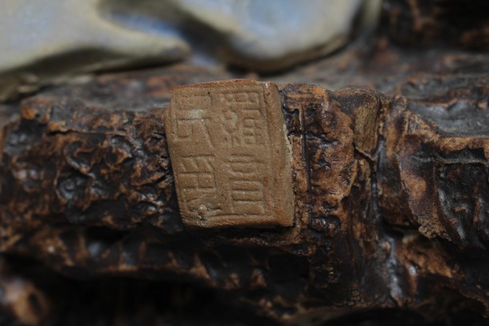 A CHINESE SHIWAN STONEWARE FIGURE Image