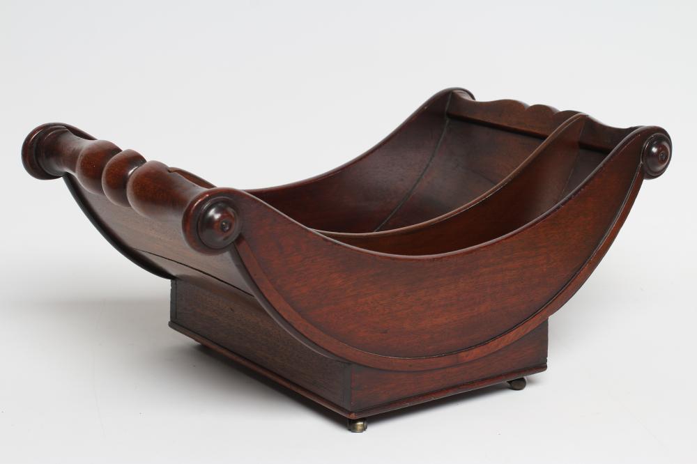 A REGENCY MAHOGANY CHEESE COASTER of typical dished form with centre division Image